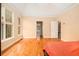 Spacious main bedroom featuring hardwood floors, large windows and neutral paint at 4236 Providence Ln, Tucker, GA 30084