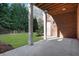 Covered outdoor space in backyard featuring brick, columns, and direct yard access at 821 Camden Park Ct, Atlanta, GA 30342