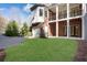Backyard featuring large grassy space and outdoor patio with garage access at 821 Camden Park Ct, Atlanta, GA 30342