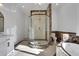 Chic bathroom featuring a glass shower, designer fixtures, and marble accents, offering a spa-like experience at 821 Camden Park Ct, Atlanta, GA 30342