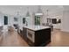 Bright open kitchen with a large island, modern appliances, and views to the living area at 821 Camden Park Ct, Atlanta, GA 30342