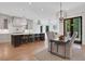 An elegant kitchen with a center island, modern lighting, and open layout at 821 Camden Park Ct, Atlanta, GA 30342