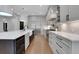 Modern kitchen features stainless appliances, quartz countertops, and elegant cabinetry at 821 Camden Park Ct, Atlanta, GA 30342