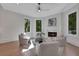 Sun-drenched sitting room with a fireplace and scenic views at 821 Camden Park Ct, Atlanta, GA 30342
