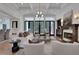 Bright living room with fireplace, recessed lights, and stylish furniture, perfect for relaxing or entertaining guests at 821 Camden Park Ct, Atlanta, GA 30342