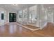 Expansive living room with hardwood floors, elegant columns, and open floor plan, ideal for entertaining and relaxation at 821 Camden Park Ct, Atlanta, GA 30342