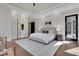Bright main bedroom with a tray ceiling, a luxurious bed, and an ensuite bathroom for ultimate relaxation at 821 Camden Park Ct, Atlanta, GA 30342