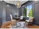 Sophisticated office with custom wall trim, statement chandelier, and large windows providing ample natural light at 821 Camden Park Ct, Atlanta, GA 30342