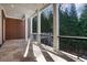 Covered outdoor patio with stone flooring and wrought iron railings, ideal for outdoor dining at 821 Camden Park Ct, Atlanta, GA 30342