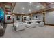 Theater room offers comfortable seating, a massive screen, and custom lighting for an immersive experience at 821 Camden Park Ct, Atlanta, GA 30342