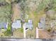 Aerial view of the property showcasing the home, driveway, and expansive yard at 1991 Mcafee Pl, Decatur, GA 30032