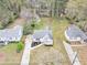 Aerial view of the property showcasing the home, driveway, and expansive yard at 1991 Mcafee Pl, Decatur, GA 30032