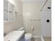 A bathroom has a shower with white tile, a grey vanity, and modern fixtures at 1991 Mcafee Pl, Decatur, GA 30032