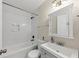 Cozy bathroom with white tile, gray vanity, and modern fixtures at 1991 Mcafee Pl, Decatur, GA 30032