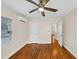 This room features hardwood floors and an air conditioning unit above a door at 1991 Mcafee Pl, Decatur, GA 30032