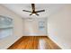 The bedroom has two windows, an air conditioning unit, and hardwood flooring at 1991 Mcafee Pl, Decatur, GA 30032