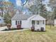 Charming home featuring a well-manicured lawn, fresh landscaping, and inviting front porch at 1991 Mcafee Pl, Decatur, GA 30032