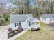 Charming home featuring a covered porch and professionally landscaped front yard at 1991 Mcafee Pl, Decatur, GA 30032