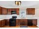 Modern kitchen featuring dark cabinetry, sleek appliances, and ample counter space at 1991 Mcafee Pl, Decatur, GA 30032