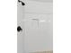 A walk-in shower has white tile and modern fixtures at 1991 Mcafee Pl, Decatur, GA 30032