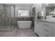 This light and airy bathroom features a soaking tub and frameless glass shower at 2041 Briarcliff Ne Rd, Atlanta, GA 30329