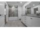 Bright bathroom featuring dual vanity with granite countertops, tiled shower, and modern fixtures at 2041 Briarcliff Ne Rd, Atlanta, GA 30329
