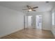 This light bedroom features hardwood floors, white walls, ceiling fan and en suite bathroom at 2041 Briarcliff Ne Rd, Atlanta, GA 30329