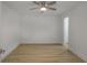 This bedroom features hardwood floors, white walls, ceiling fan and en suite bathroom at 2041 Briarcliff Ne Rd, Atlanta, GA 30329