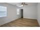 This bedroom features hardwood floors, white walls, ceiling fan and walk in closet at 2041 Briarcliff Ne Rd, Atlanta, GA 30329