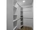 Bright closet with white shelving and hanging rods for optimal organization and storage at 2041 Briarcliff Ne Rd, Atlanta, GA 30329