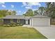 Charming single-story home featuring a well-manicured lawn, painted brick, and an attached two-car garage at 2041 Briarcliff Ne Rd, Atlanta, GA 30329