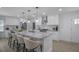 Modern kitchen featuring white cabinetry, stainless steel appliances, a spacious island, and bar seating for casual dining at 2041 Briarcliff Ne Rd, Atlanta, GA 30329
