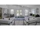 Bright living room with vaulted ceilings, modern furnishings, and ample windows, creating a relaxing and inviting atmosphere at 2041 Briarcliff Ne Rd, Atlanta, GA 30329