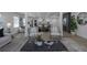 A view of the open-concept living room featuring modern decor, plenty of natural light, and seamless access to the kitchen at 2041 Briarcliff Ne Rd, Atlanta, GA 30329