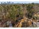 Lovely two-story home featuring a spacious front yard with towering trees, providing a tranquil atmosphere at 725 Glengary Ne Way, Atlanta, GA 30342