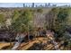 Attractive two-story house with a well-maintained yard, nestled among tall trees for added seclusion at 725 Glengary Ne Way, Atlanta, GA 30342