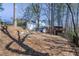 View of the back of home, wooden deck, mature trees and landscaped backyard at 725 Glengary Ne Way, Atlanta, GA 30342