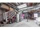 Unfinished basement area with exposed ductwork, water heater and stairs to the upper level at 725 Glengary Ne Way, Atlanta, GA 30342