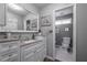 Clean bathroom with white cabinetry, a spacious vanity, and neutral decor at 725 Glengary Ne Way, Atlanta, GA 30342