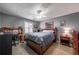 Bedroom with neutral walls, ceiling fan, and a desk and chair by the window for a quiet study space at 725 Glengary Ne Way, Atlanta, GA 30342