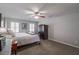 Well-lit bedroom with carpet, neutral walls, and coordinated furnishings at 725 Glengary Ne Way, Atlanta, GA 30342