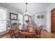 Bright dining room featuring hardwood floors, neutral walls, and classic furnishings at 725 Glengary Ne Way, Atlanta, GA 30342