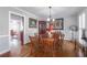 Light-filled dining room features a classic table, wood floors, and attractive wall decor at 725 Glengary Ne Way, Atlanta, GA 30342