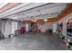 Spacious two-car garage providing parking and additional storage, complete with shelving and work area at 725 Glengary Ne Way, Atlanta, GA 30342