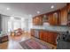 Well-appointed kitchen with wood cabinets, granite countertops, and stainless steel appliances at 725 Glengary Ne Way, Atlanta, GA 30342