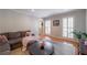 Bright living room with natural light, hardwood floors, and a comfortable seating area at 725 Glengary Ne Way, Atlanta, GA 30342