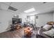 Open living room/office featuring wood floors, a comfortable couch, and a desk setup for a dedicated workspace at 725 Glengary Ne Way, Atlanta, GA 30342