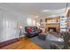 Bright living room with a fireplace, sofa, and hardwood floors at 725 Glengary Ne Way, Atlanta, GA 30342