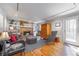 Cozy living room with hardwood floors, brick fireplace, and comfortable furnishings at 725 Glengary Ne Way, Atlanta, GA 30342