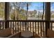 Relaxing outdoor balcony with seating, a small table, and a pleasant nature view at 3371 Dogwood Dr # 220, Hapeville, GA 30354